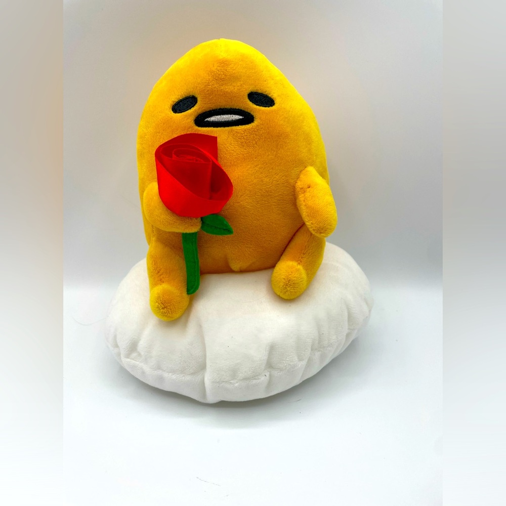 gudetama by Sanrio egg  plushy holding a rose